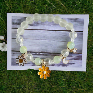 Sunshine Smiles: Clear Beaded Bracelet with Yellow Flower